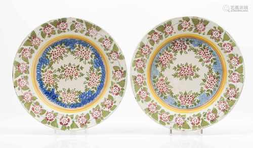 A pair of large deep platesPortuguese faienceFloral polychrome decoration19th centuryb