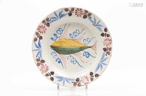 A platePortuguese faiencePolychrome decoration with fish19th century(chips and hair