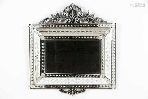 A Venetian mirrorCase frame of engraved and scalloped decoration20th century (1st half)