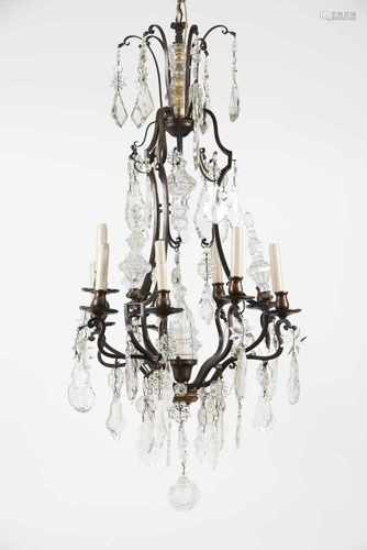 A nine branch chandelierMetal frame with glass and crystal drops20th century (1st half)