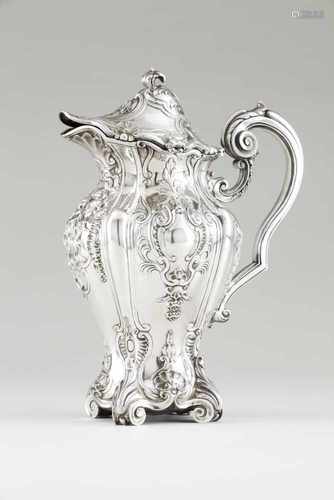 An important jug and coverPortuguese silverAmphora shaped body of exquisite repousse and ch