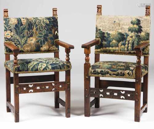 A pair of armchairsWalnutCarved decorationTapestry upholstered seats and backsItaly