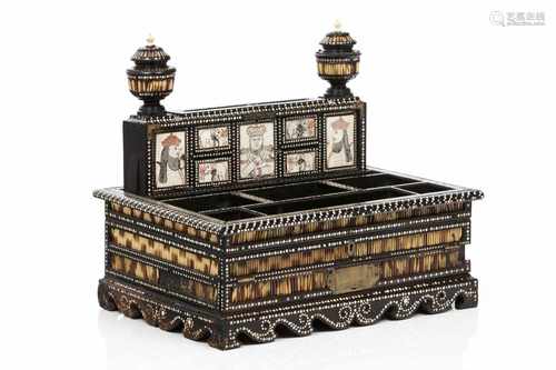 An Anglo-Indian portable writing caseEbony, of carved decoration with ivory inlays and porcupin