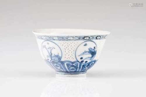 A bowlChinese porcelainBlue decoration with cartouches depicting landscapesBody with pi