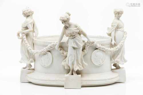 A flower bowlBiscuit porcelaindepicting the Three Graces holding garlandsMedallions wit