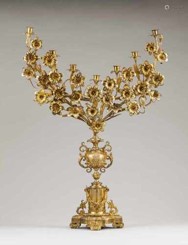 A palm/seven branch candelabraGilt bronzeUrns on neoclassical plinth shafts and flower deco