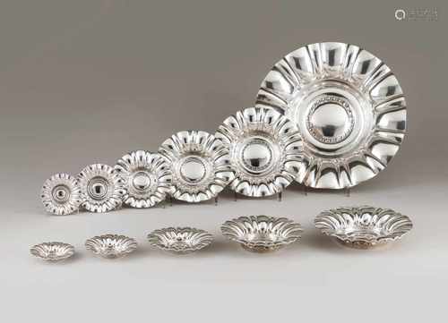 A set of twelve salversPortuguese silverDecreasing sizesgadrooned decoration of leaf bo