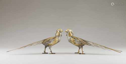 A pair of pheasantsWhite and gilt silverSculpted pheasants of raised, scalloped and chisell