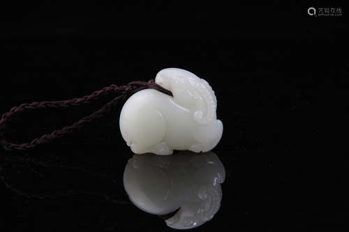 A CHINESE HETIAN JADE SHEEP ORNAMENT