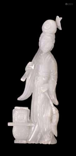 A LATE QING DYNASTY WHITE JADE CARVING OF A STANDI…