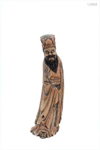 A LARGE IVORY CARVING OF A STANDING SAGE China, ea…