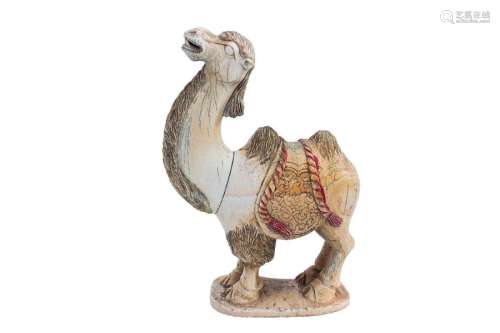 A PAINTED IVORY CARVING OF A CAMEL China, early 20…