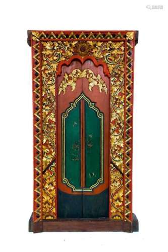 A BALINESE PAINTED AND GILT CARVED WOOD DOOR Early…