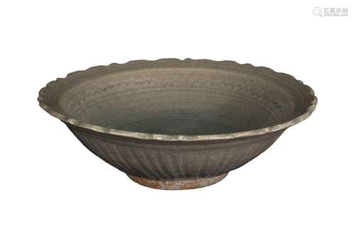 A SAWANKHALOK CÉLADON GLAZED DISH WITH BARBED RIM …