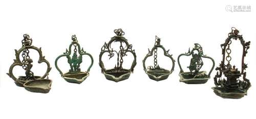 SIX INDONESIAN BRONZE OIL LAMPS the larger 18 x 22…