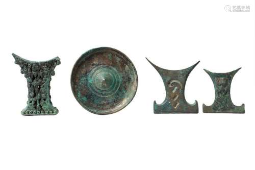 THREE INDONESIAN BRONZE MIRROR HANDLES AND A MIRRO…