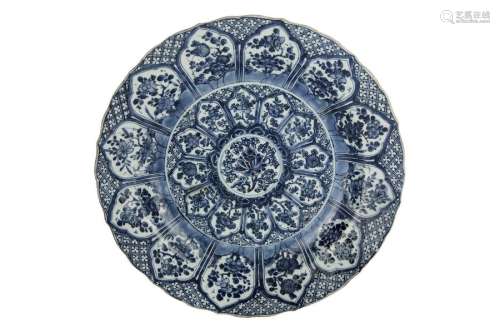 A LARGE BLUE AND WHITE DISH WITH BARBED RIM \nChina…