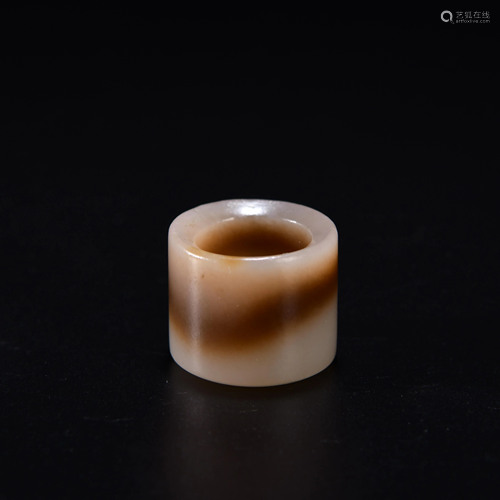 A CHINESE JADE THUMB RING