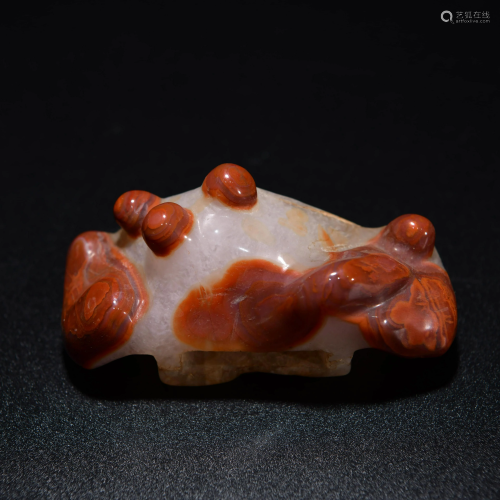 A CHINESE CARVED AGATE SWORD PENDANT