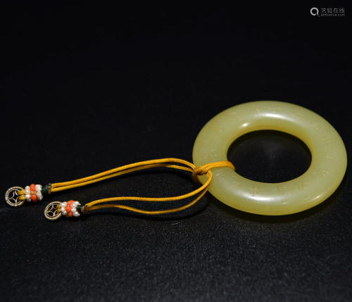 A CHINESE INSCRIBED YELLOW JADE …