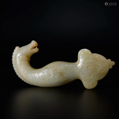 A CHINESE CARVED JADE SWORD PENDANT