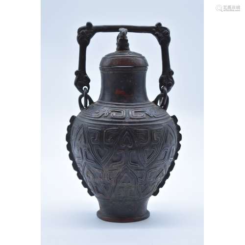 WITHDRAWN FROM SALE: A Chinese Archaistic bronze swing handled wine vessel and cover Hu,