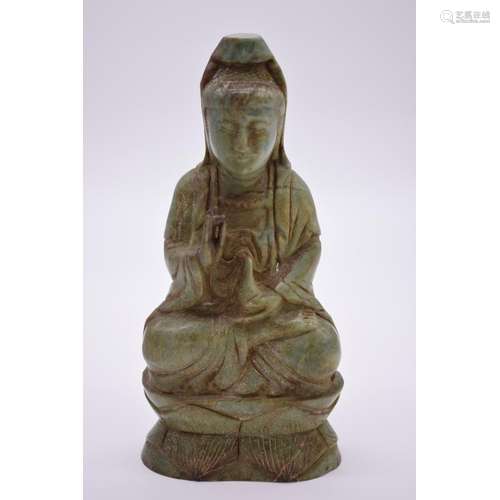 A Chinese carved soapstone figure of Guanyin,