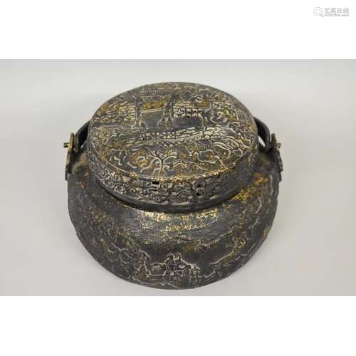 A Chinese bronze swing handled vessel and pierced cover,