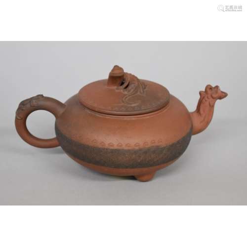 A Chinese yixing teapot and cover,