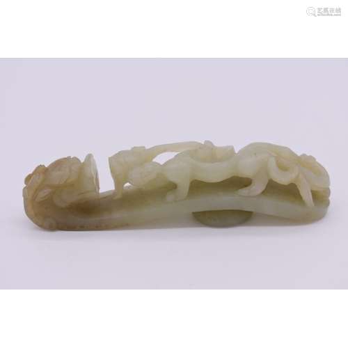 A Chinese celadon jade dragon belt hook,