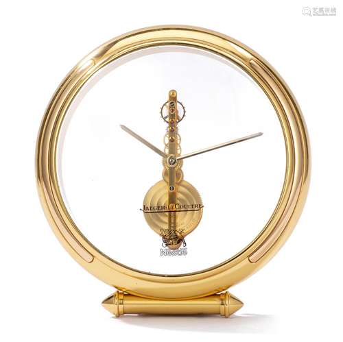 Pendulette de table Jaeger-LeCoultre de forme ronde à lunette et pied en métal [...]