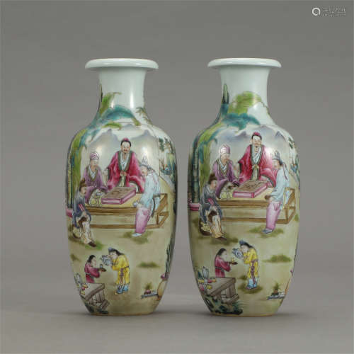 A PAIR OF CHINESE FAMILLE ROSE FIGURE AND STORY VASE