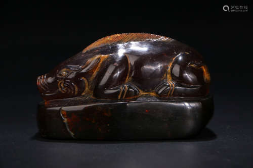 A Chinese Carved Amber Beast Ornament