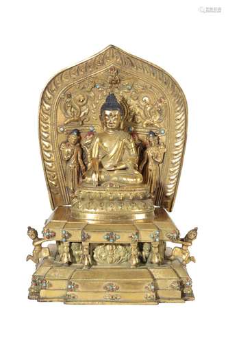 GILT-BRONZE FIGURE OF BUDDHA SHAKYAMUNI ON A STEPPED THRONE, TIBET, 16TH CENTURY OR LATER