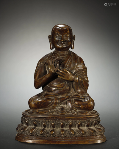 A BRONZE FIGUER OF A GURU