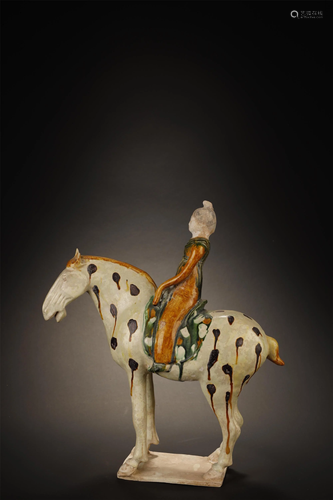 A SANCAI GLAZED FIGUER OF FEMAL RIDING…