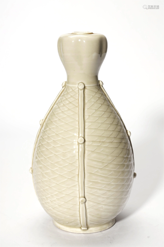 A WHITE GLAZED INCISED VASE