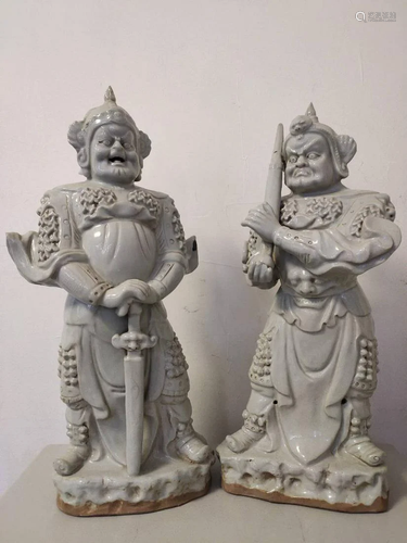 PAIR OF WHITE GLAZED WARRIOR FIGUERS