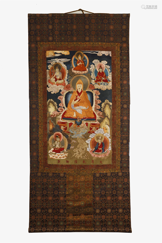 A EMBROIDERED SILK THANGKA, MARKED