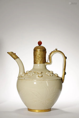 A GILT METAL MOUNTED WHITE GLAZE…