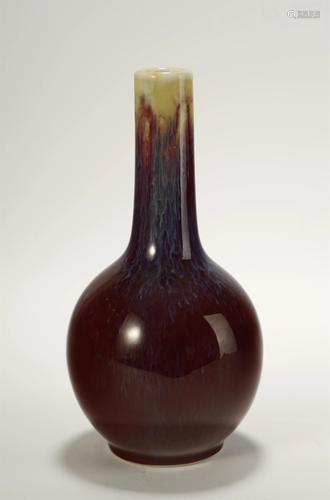 A FLAMBE GLAZED BOTTLE VASE