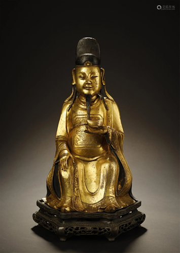 A GILT BRONZE GOD OF WEALTH FIGUER