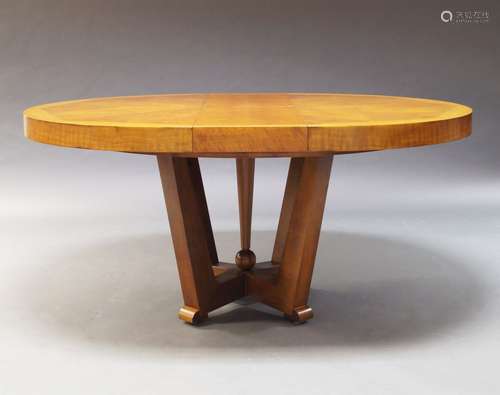 A modern walnut extending dining table, of recent manufacture, the parquetry top on square