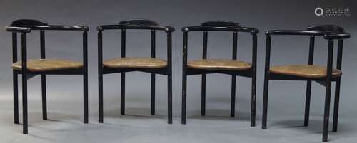 A set of four ebonised and bentwood armchairs, c.1980, with curved armrest above faux lizard skin