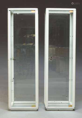 A pair of white painted wood and glass display cabinets, c.1960's/70's, each with three shelves,