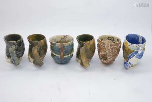 Carol McNicoll (1943-), six assorted mugs c.1990, each signed to base Six assorted slipcast mugs