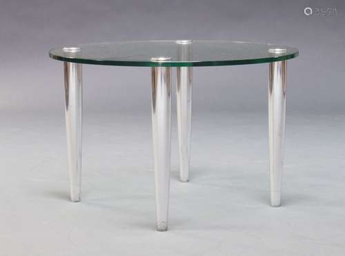 A glass and chromed side table, of recent manufacture, the glass top raised on tapering chromed