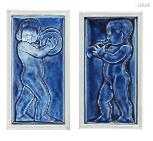 Two blue figurative tile panels 20th Century Each cast with a putti, one playing a trumpet, the