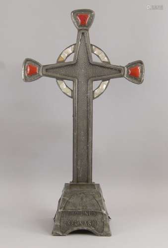 A metal and mother of pearl inlaid cross on a stand, 20th century, with red enamel cabochon