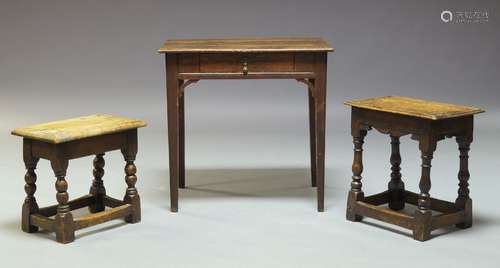 A George III oak side table, the rectangular three plank top, above single frieze drawers, raised on